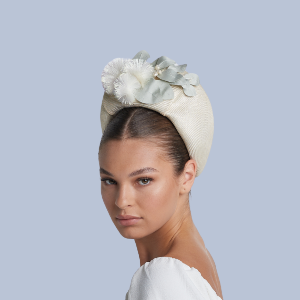 Model wearing a 1960s bubble beret with handmade fabric wattle blooms.