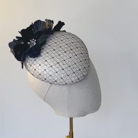 Ivory beret overlaid with vintage black veiling.